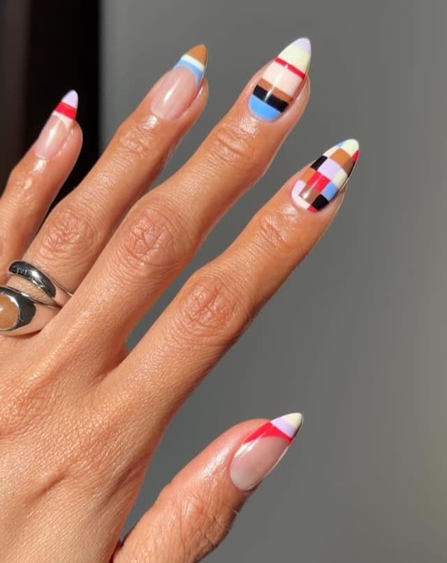 summer nail trends 2026, retro color-blocked almond nails with geometric red blue and brown tips