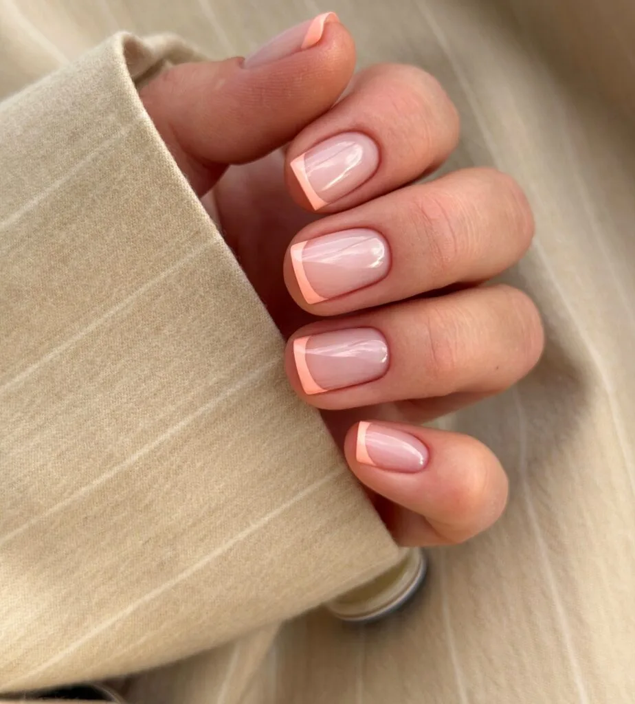 neutral summer nails, short square sheer nude nails with soft peach French tips
