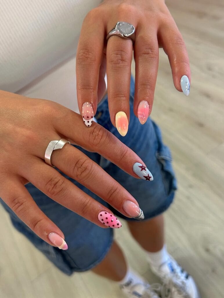 July nail ideas, eclectic mix and match almond nails with maroon stars polka dots ombre and chrome tips