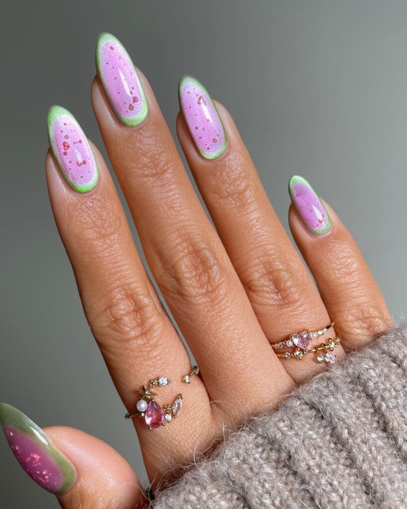 June nail ideas, watermelon art almond nails with pink glitter center and green rind outline
