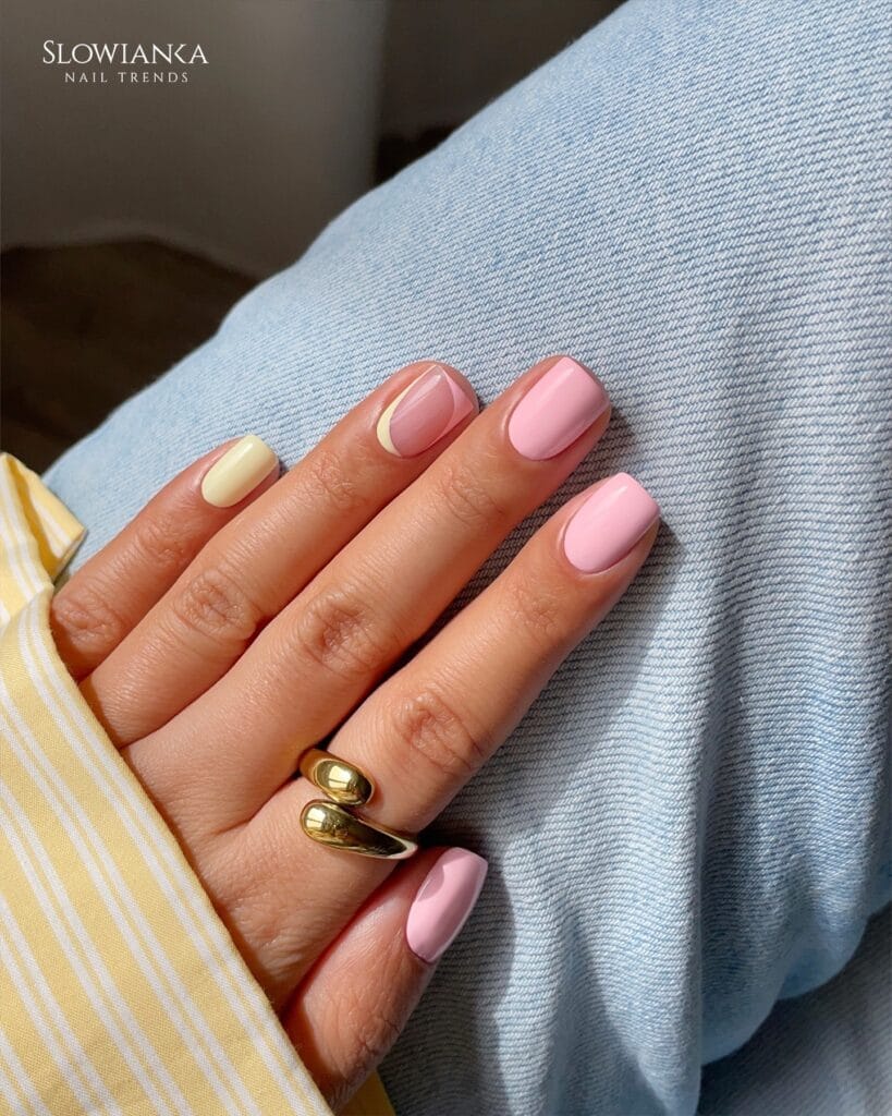 June nail ideas, baby pink glossy short square nails with butter yellow accent nail and pink and yellow outlines
