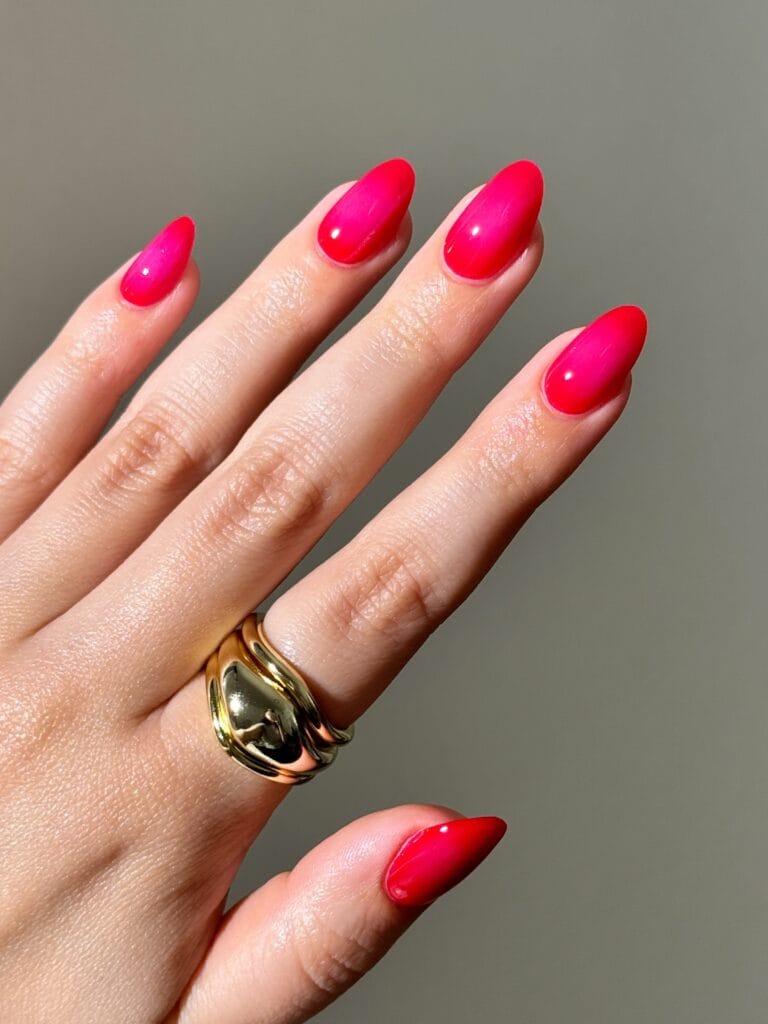 July nail ideas, hot pink and cherry red aura almond nails with glowing center and glossy finish