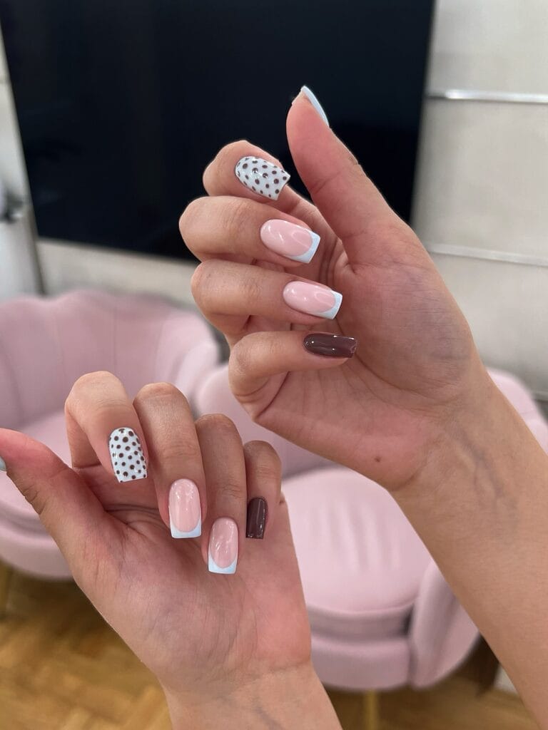 June nail ideas, mix and match square nails with baby blue French tips brown polka dots and chocolate accent

