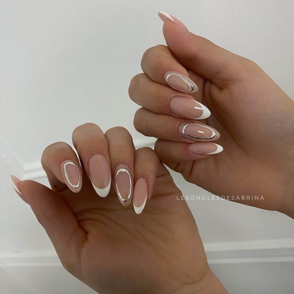 June nail ideas, white French tip almond nails with thin silver chrome outline detail

