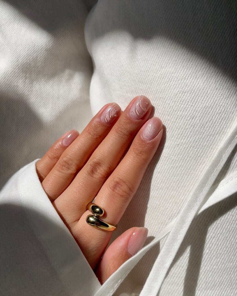 neutral summer nails, short round sheer nude shimmer nails with 3D swirl and pearl dot accents