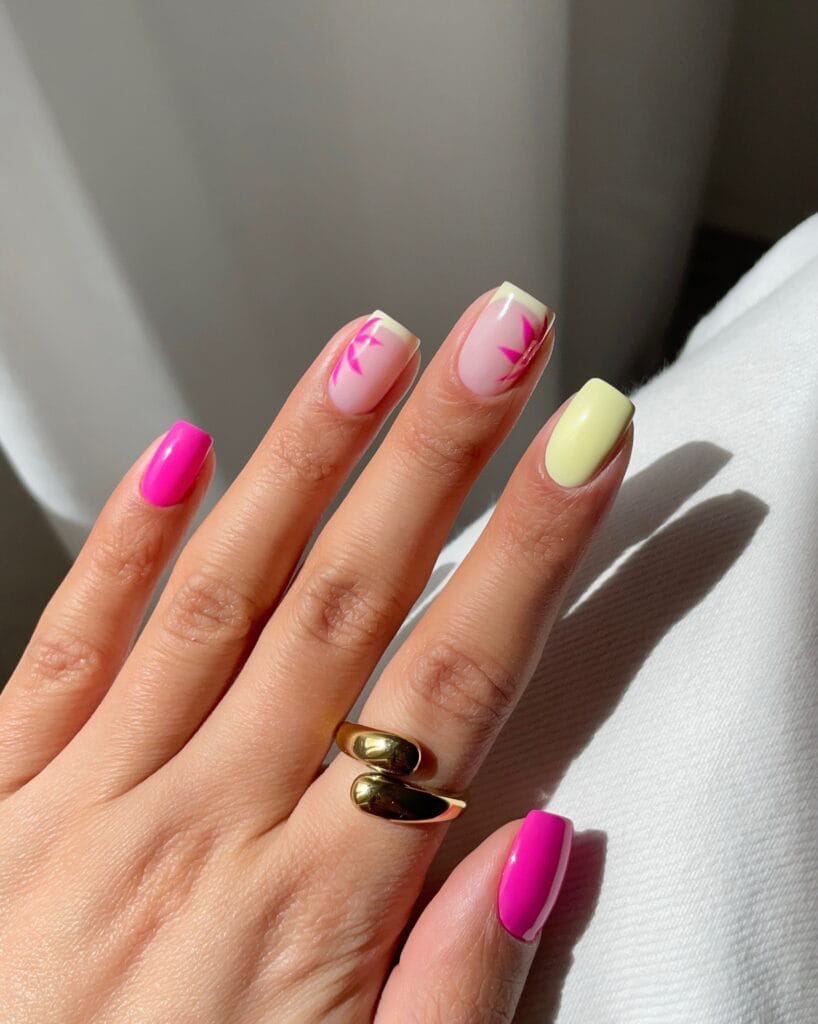 July nail ideas, pink and butter yellow short square nails with pink palm frond art and French tips
