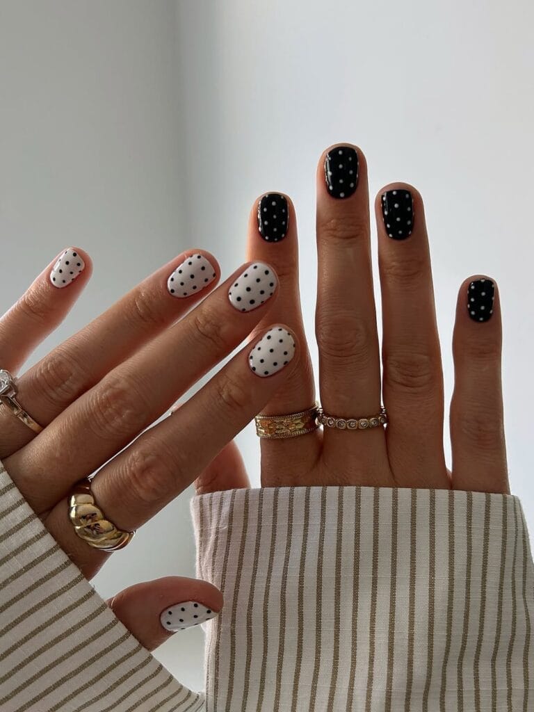 June nail ideas, alternating black and white polka dot short square nails

