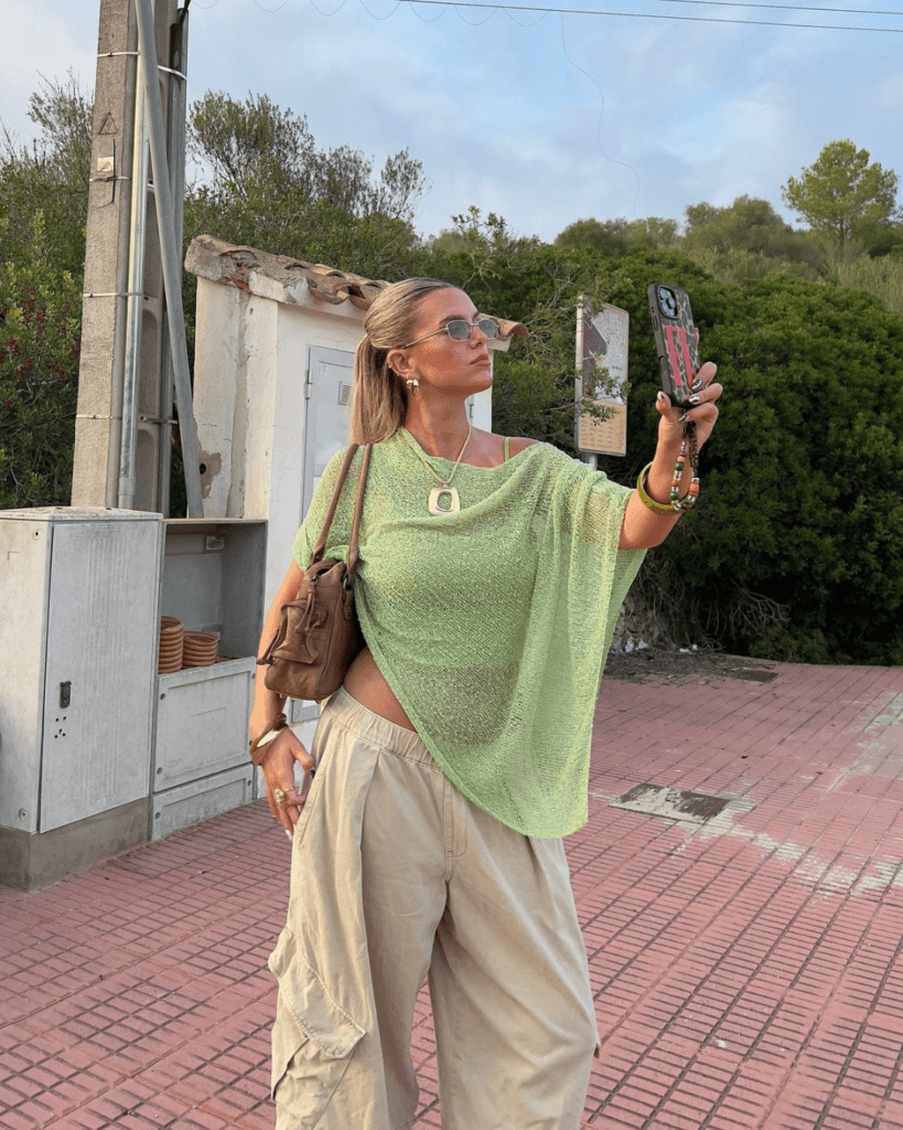 summer fashion trends 2026, green sheer mesh oversized top over bralette with beige cargo pants