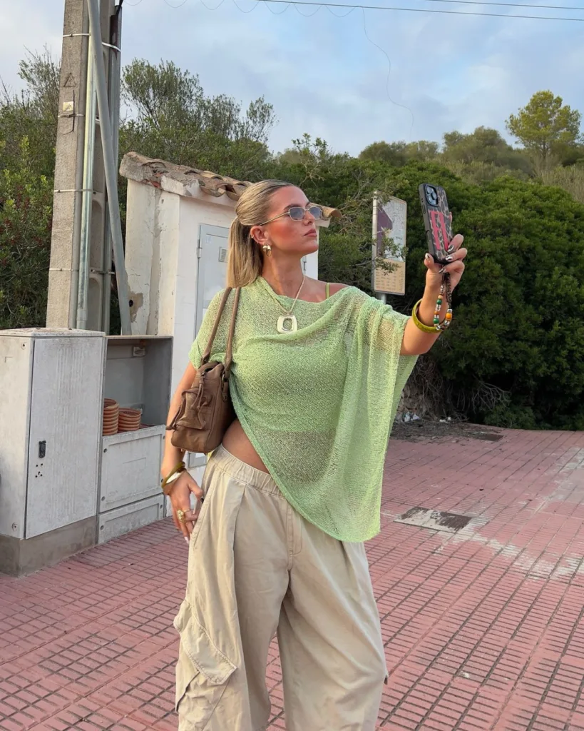 summer fashion trends 2026, green sheer mesh oversized top over bralette with beige cargo pants