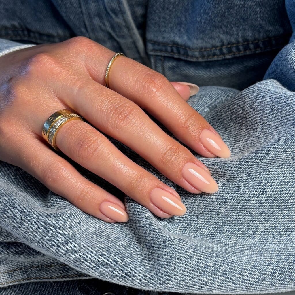 neutral summer nails, almond nude glossy solid nails with warm undertone