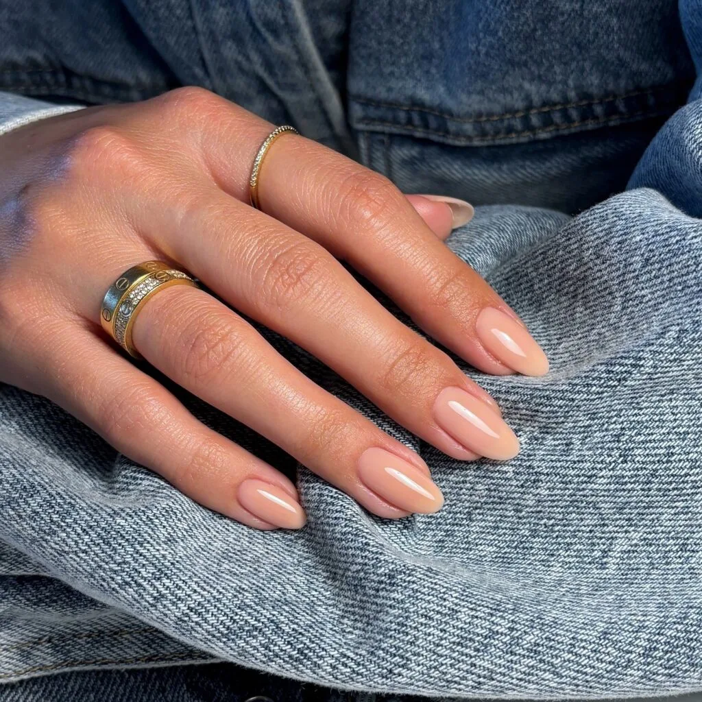 neutral summer nails, almond nude glossy solid nails with warm undertone