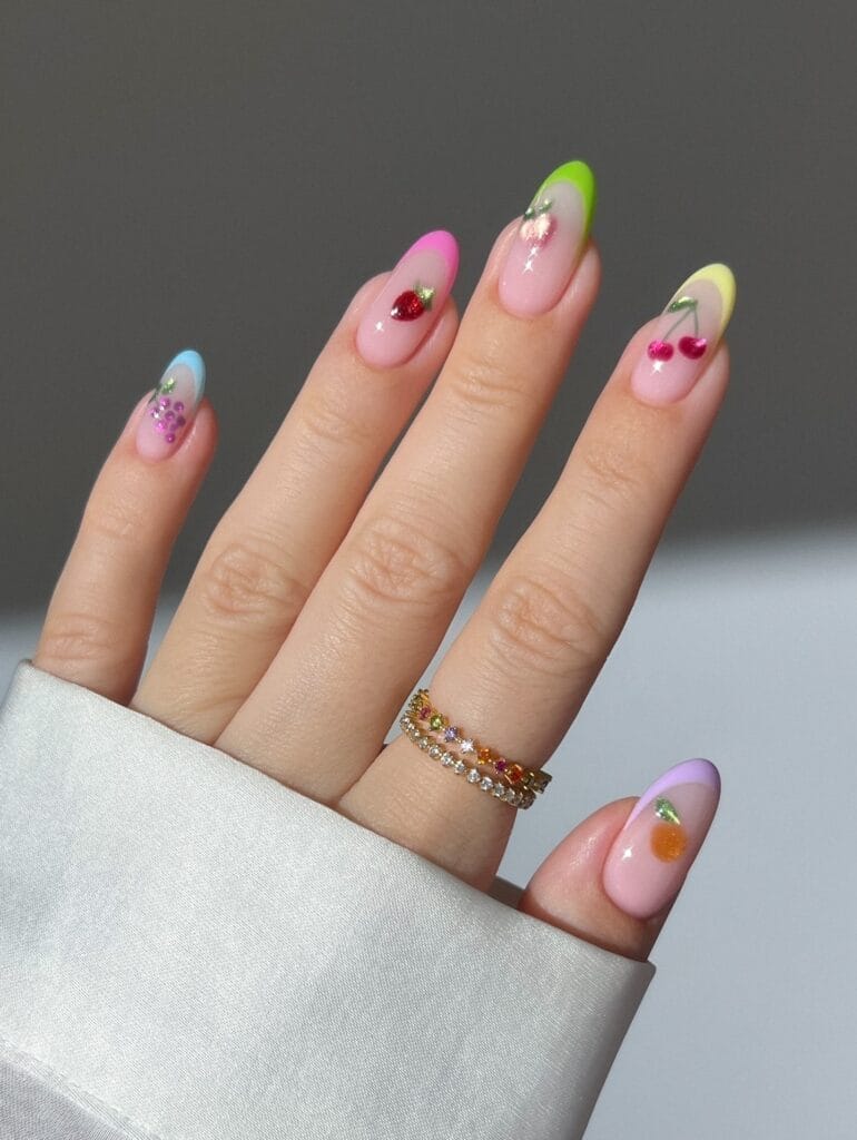 June nail ideas, colorful French tip almond nails with glitter cherry grape and peach fruit art
