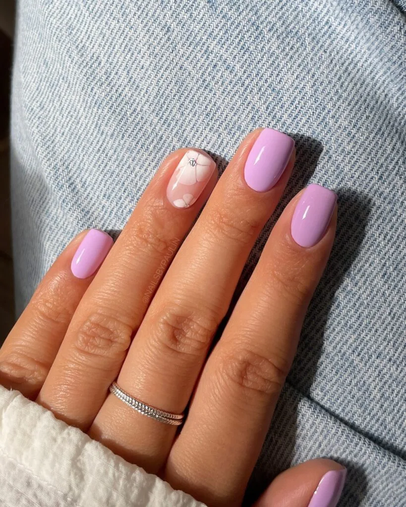 summer nail trends 2026, lavender short square nails with small white floral accent nail