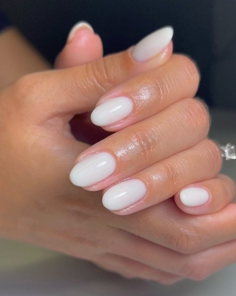 june nail color trends, milky white glossy oval nails with soft opaque finish