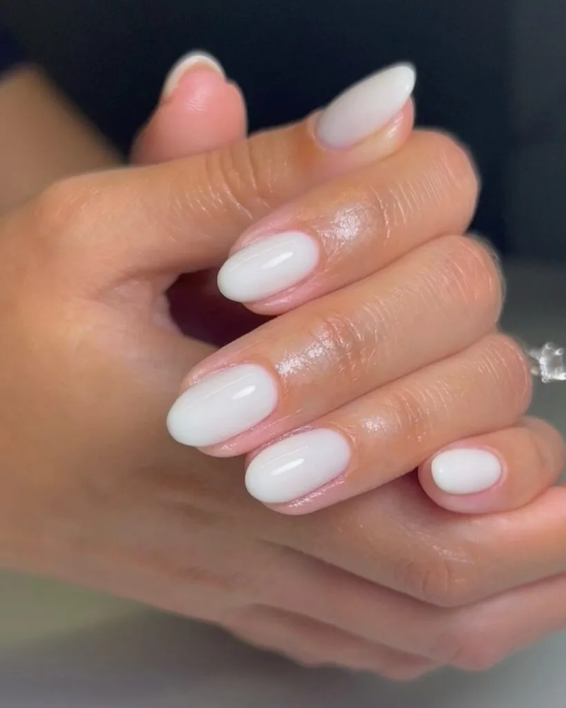 june nail color trends, milky white glossy oval nails with soft opaque finish