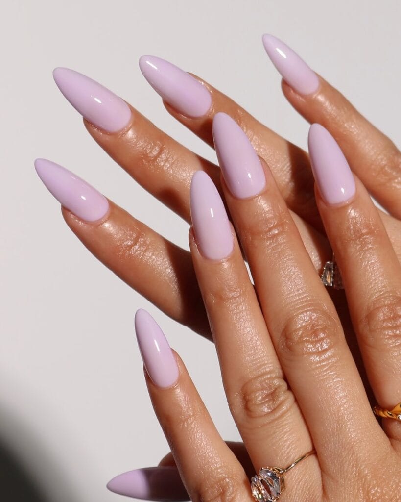 summer nail colors, milky lavender glossy almond nails with gold rings