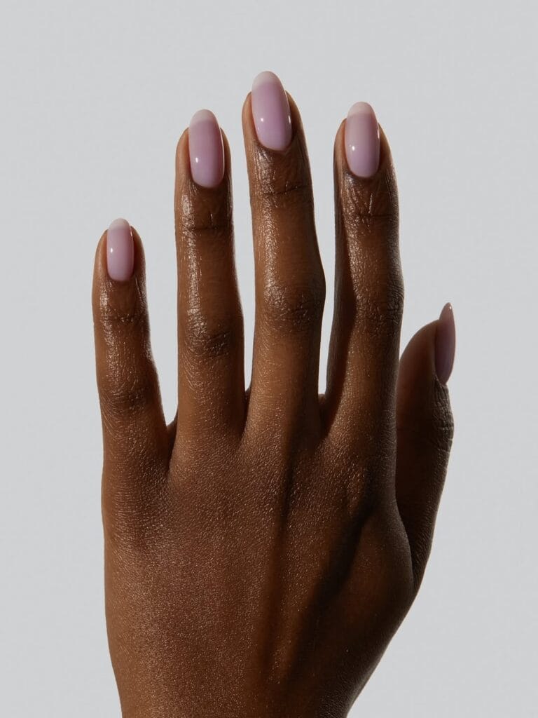 summer nail colors, milky lavender glossy almond nails on dark skin tone