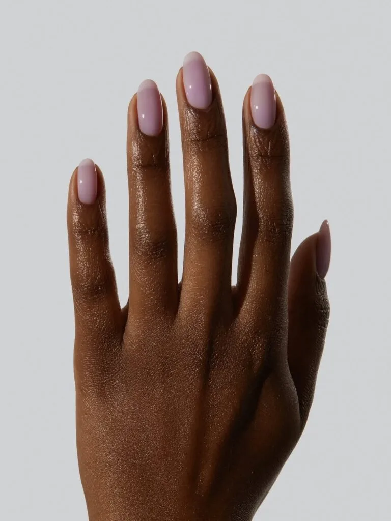 summer nail colors, milky lavender glossy almond nails on dark skin tone