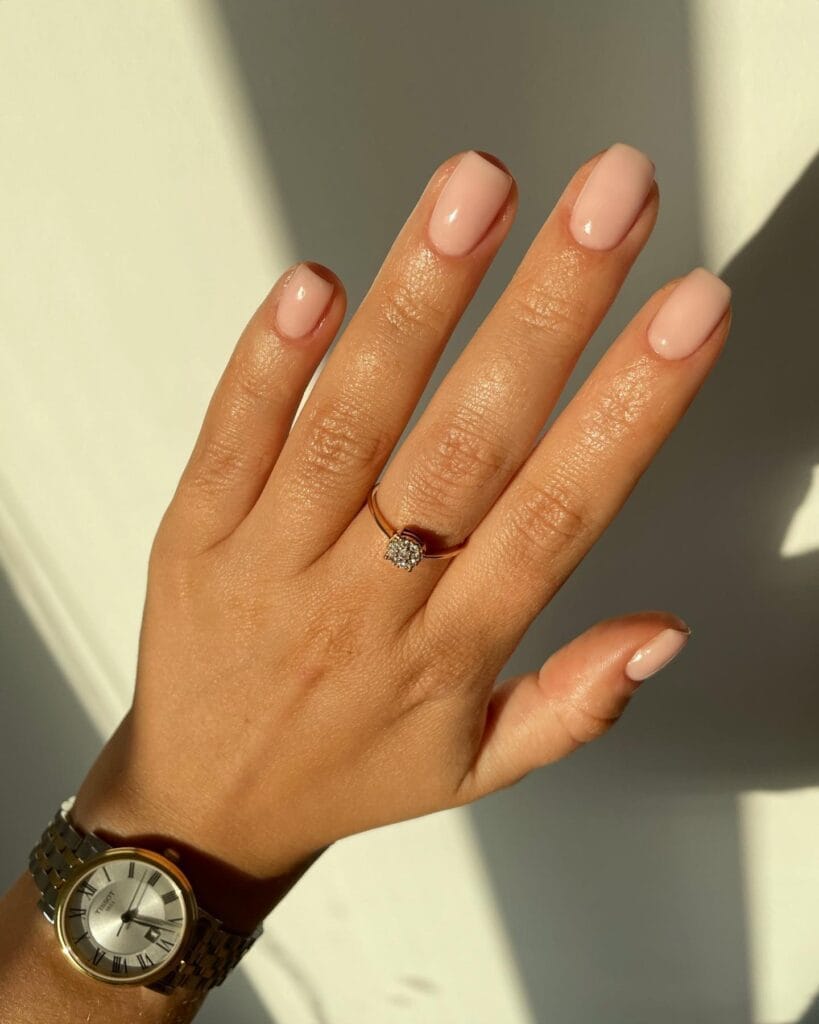 neutral summer nails, short almond nude peachy pink nails with high-gloss finish