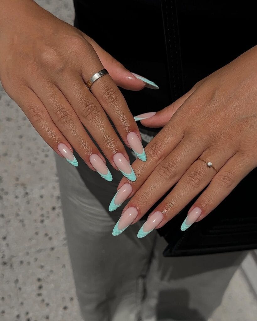 june nail color trends, turquoise French tip long almond nails on sheer nude base