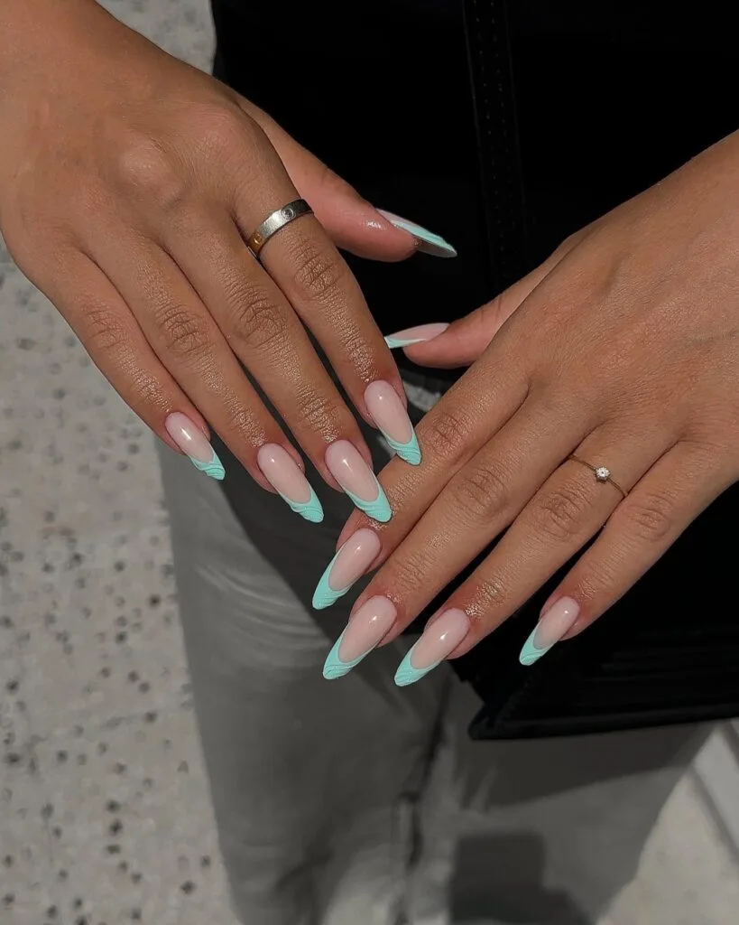june nail color trends, turquoise French tip long almond nails on sheer nude base
