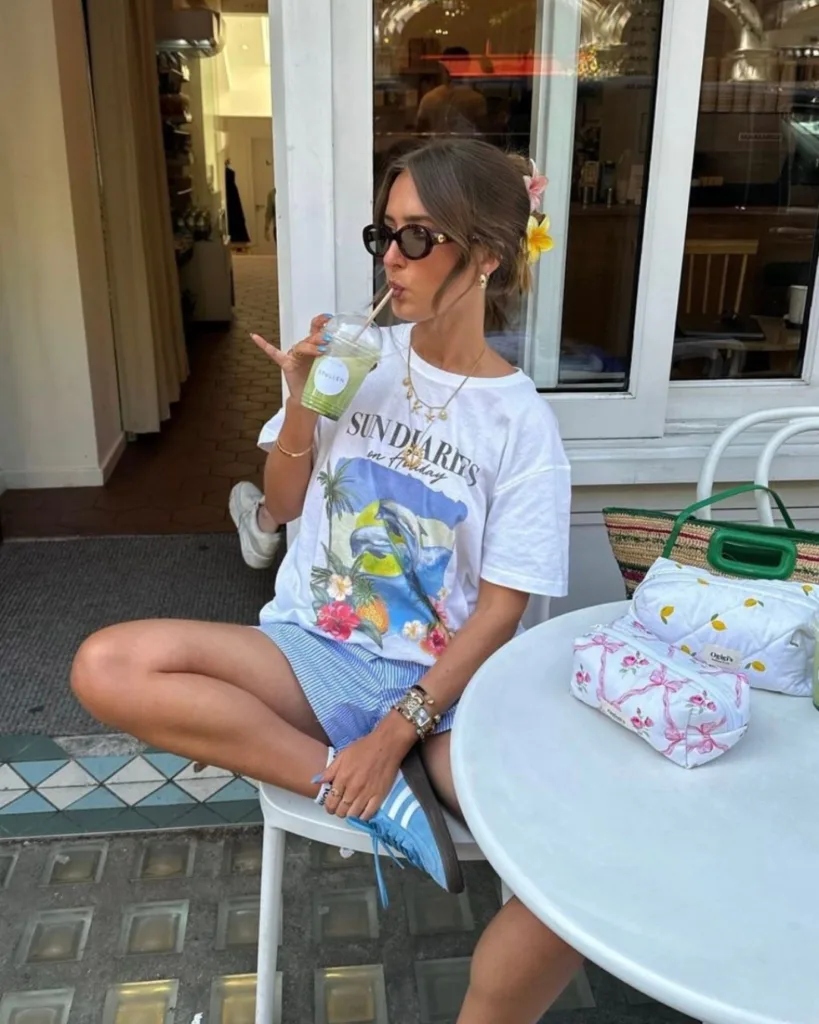 summer fashion trends 2026, blue striped boxer shorts with white graphic tee and blue sneakers