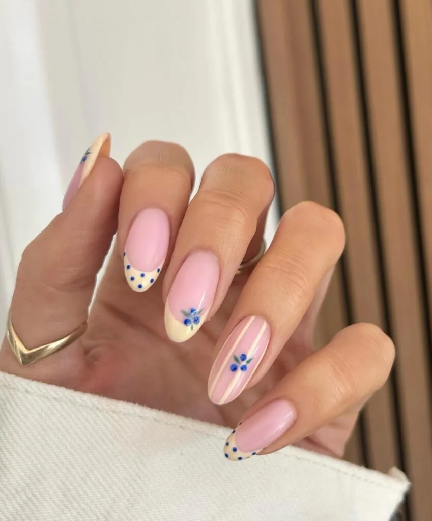 summer nail trends 2026, pink almond nails with blueberry art and cream French tips