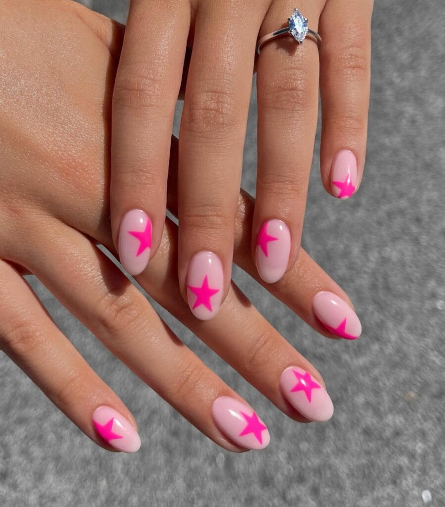 summer nail colors, hot pink star art on sheer pink almond nails with diamond ring