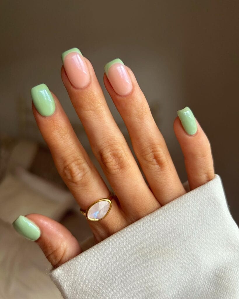 june nail color trends, olive matcha green almond nails with white polka dots and pink accent