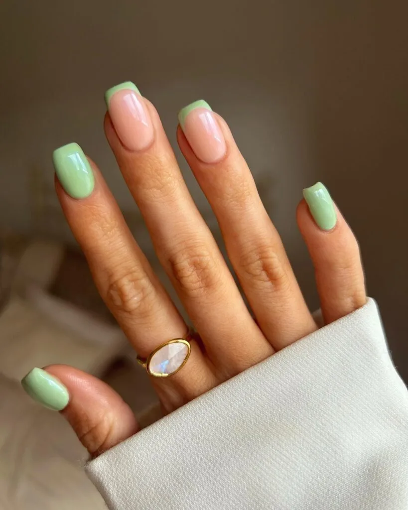 june nail color trends, olive matcha green almond nails with white polka dots and pink accent