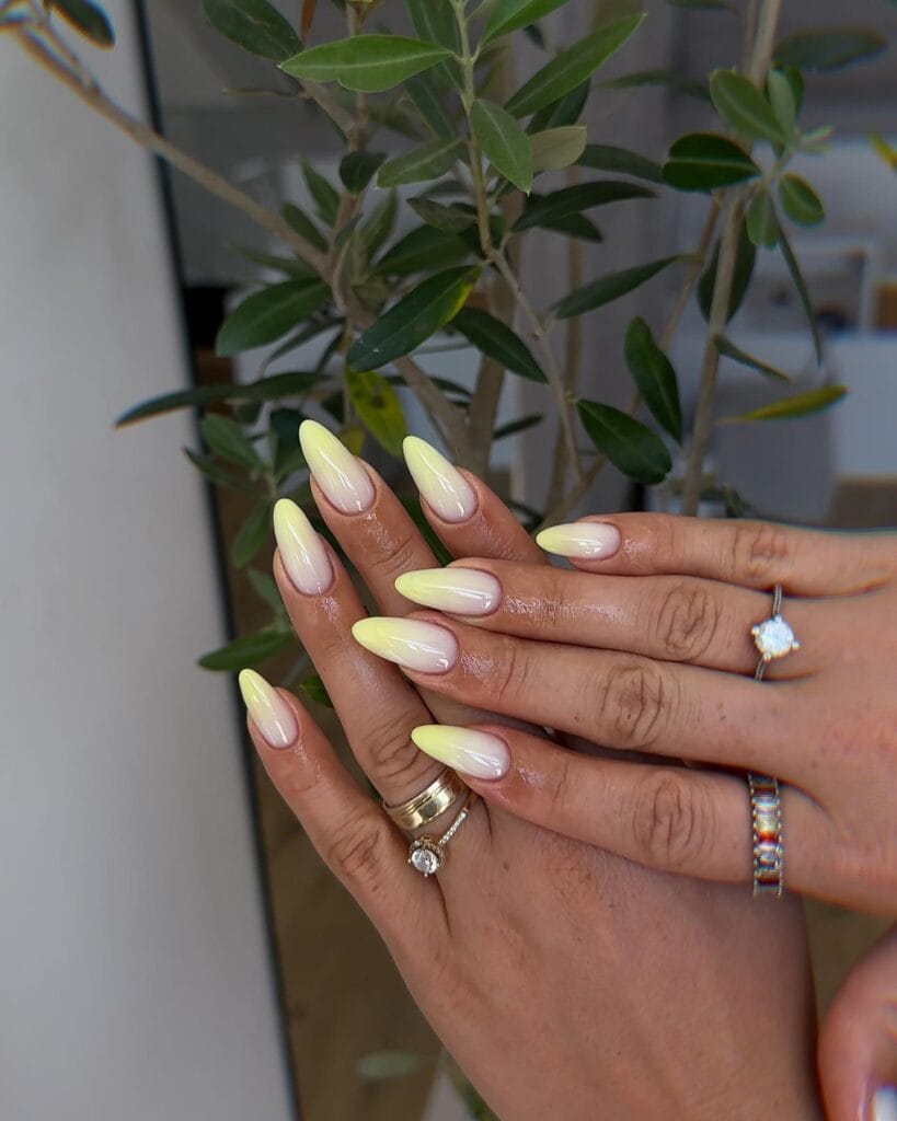 summer nail colors, pale lemon ombre almond nails with sheer base and gold rings