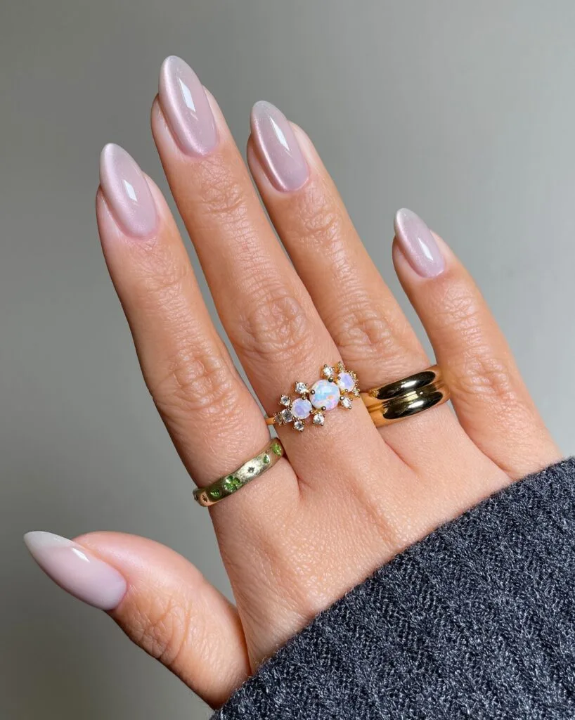 summer nail trends 2026, lavender pearlescent almond nails with micro-sheen finish and gold rings