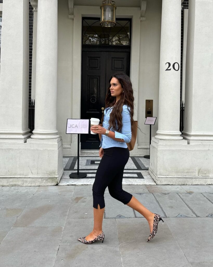 summer fashion trends 2026, black split-hem capri pants with blue button-down and leopard kitten heels