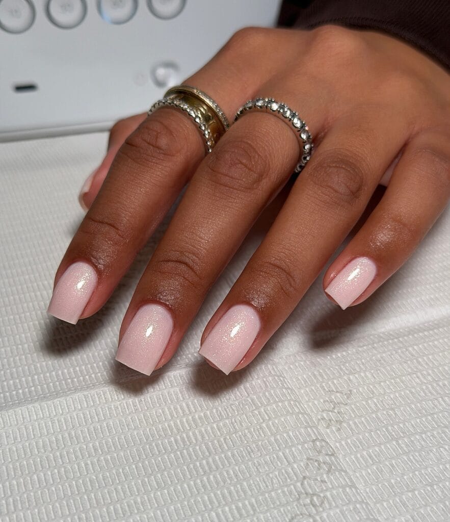 neutral summer nails, short square sheer pink nails with fine shimmer glitter finish
