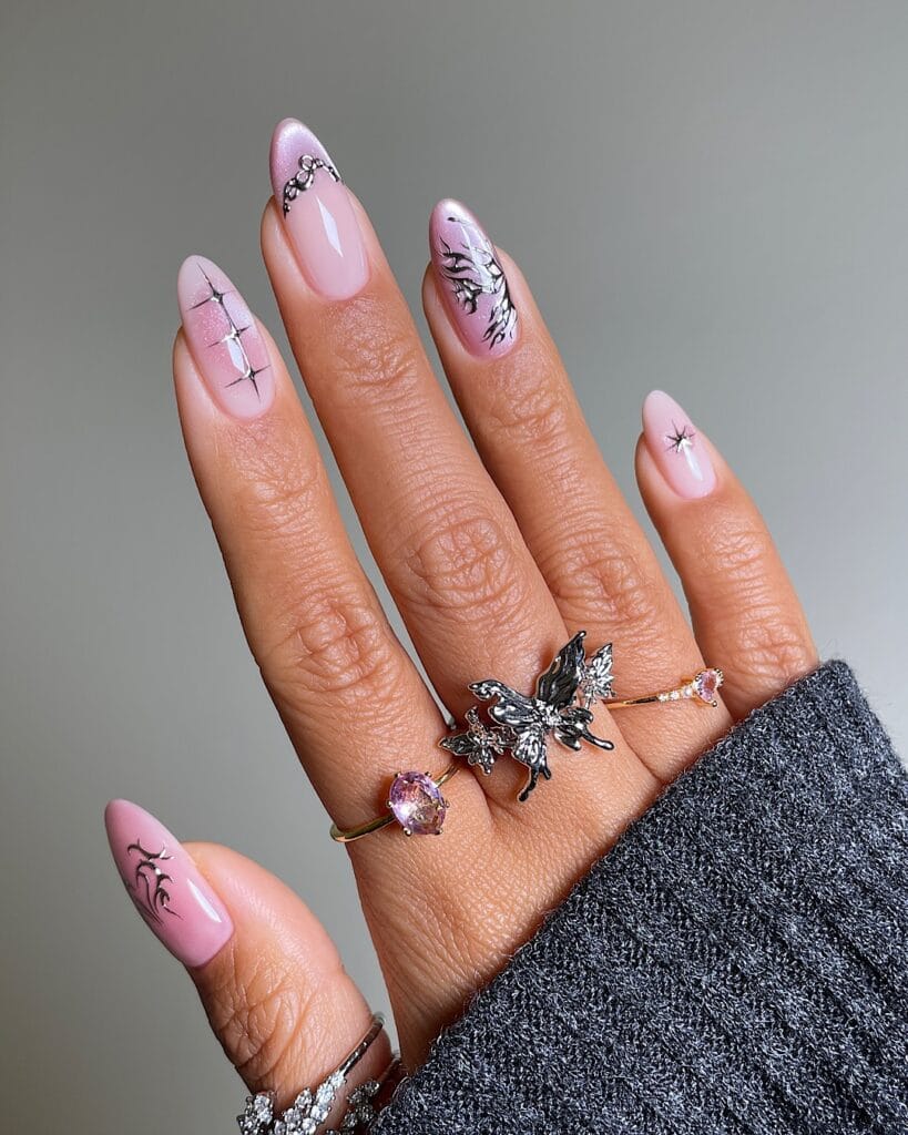 July nail ideas, pearly pink almond nails with silver chrome flowers stars and airbrushed wing mix art