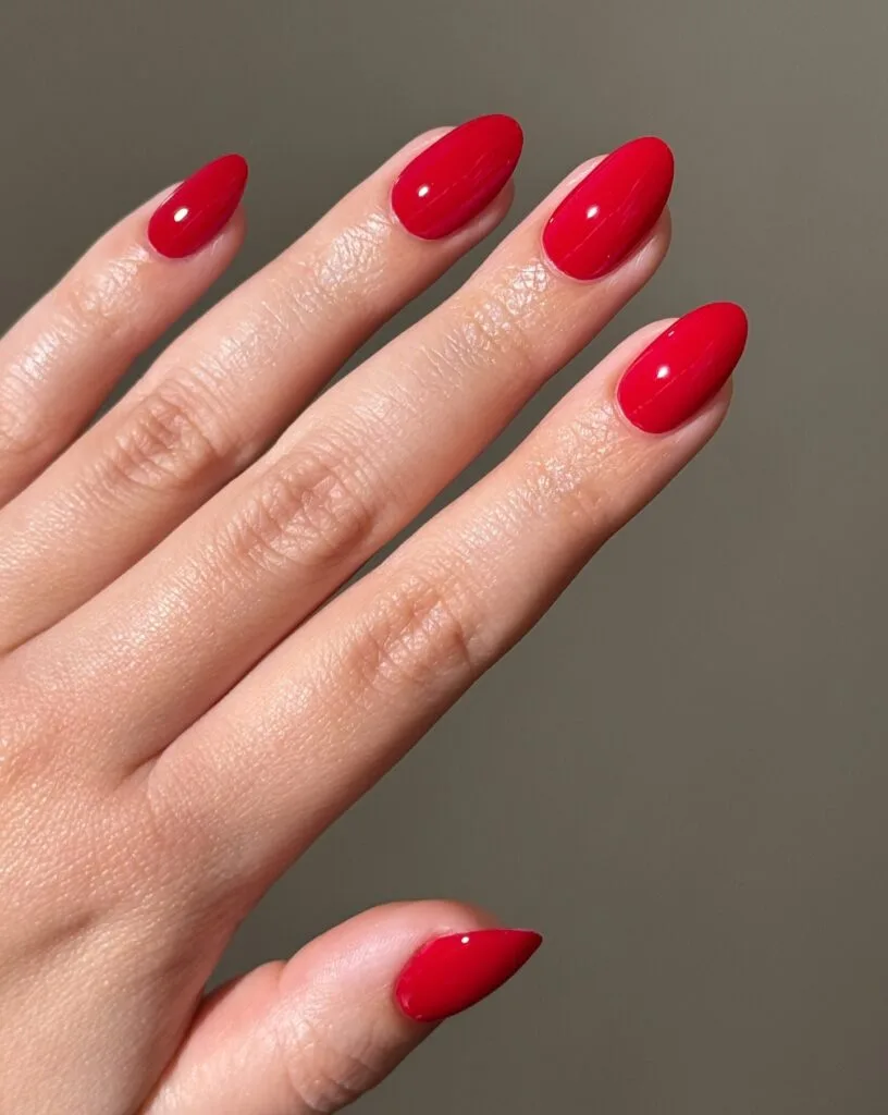 july nail colors, solid cherry red glossy almond nails