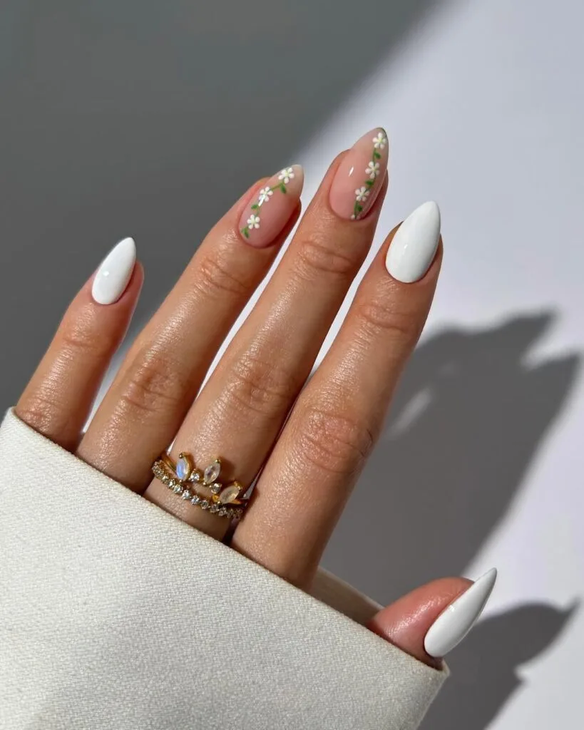 july nail colors, white almond nails with white daisy accent nails on sheer base