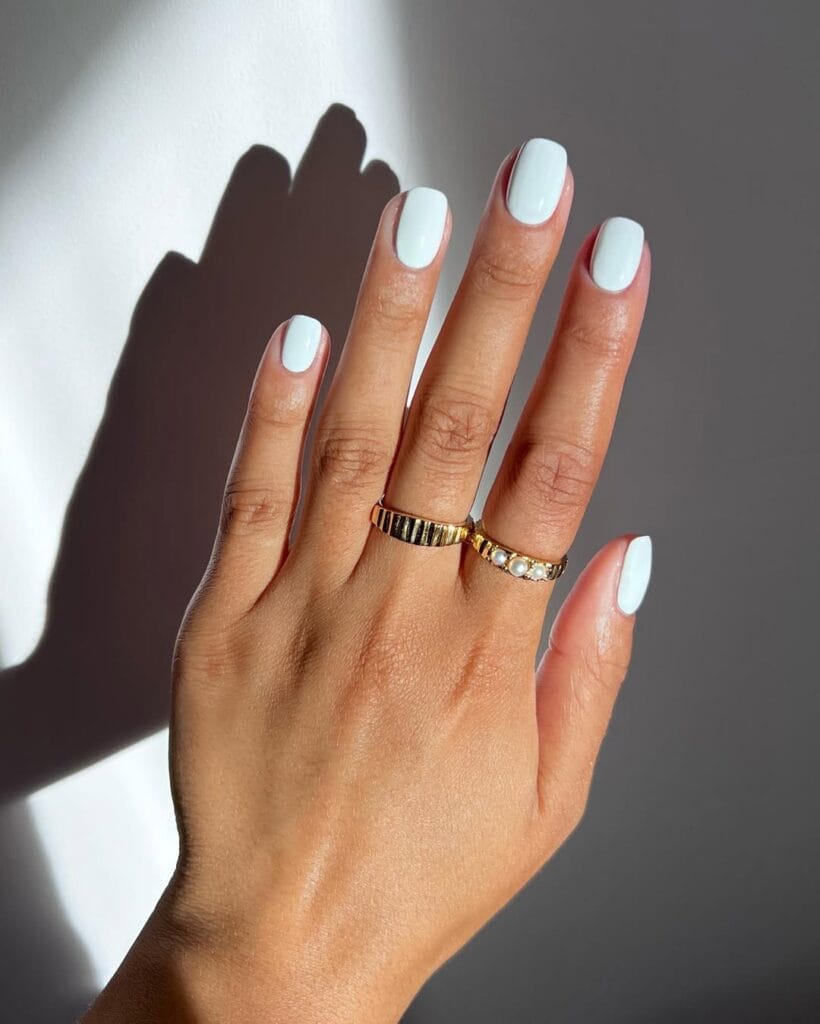 july nail colors, soft white short square nails with glossy finish