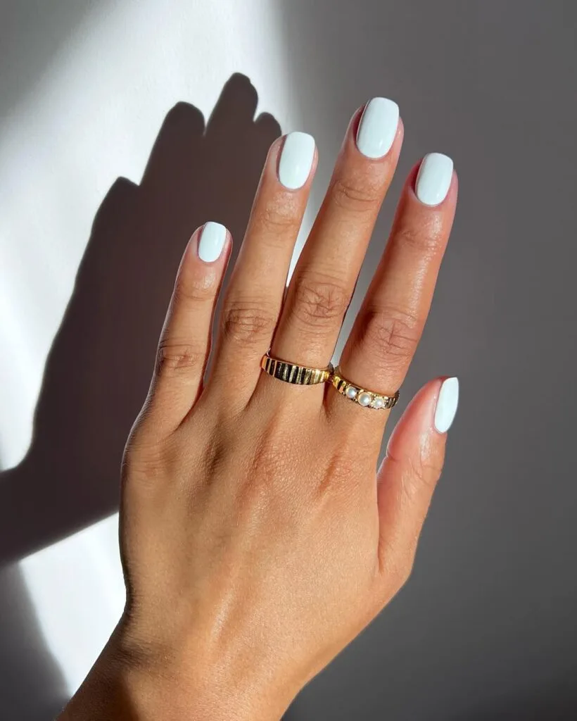 july nail colors, soft white short square nails with glossy finish