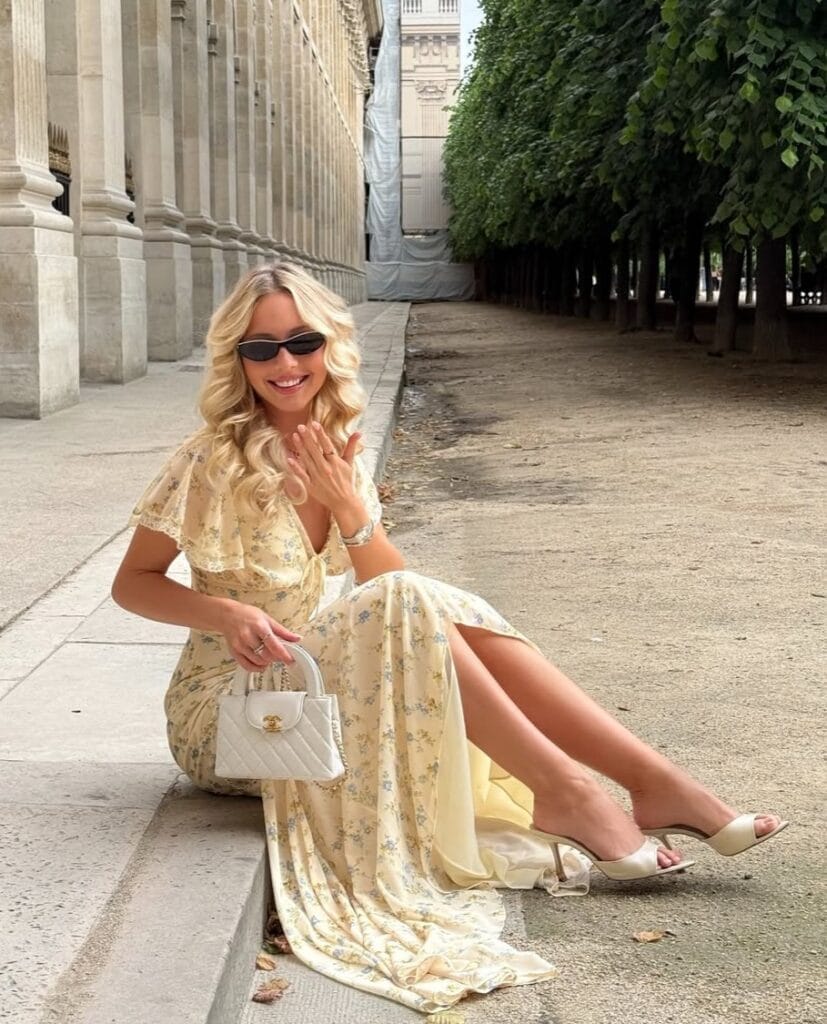 July outfit with butter yellow floral maxi dress with lace-trim flutter sleeves and cream heeled mules
