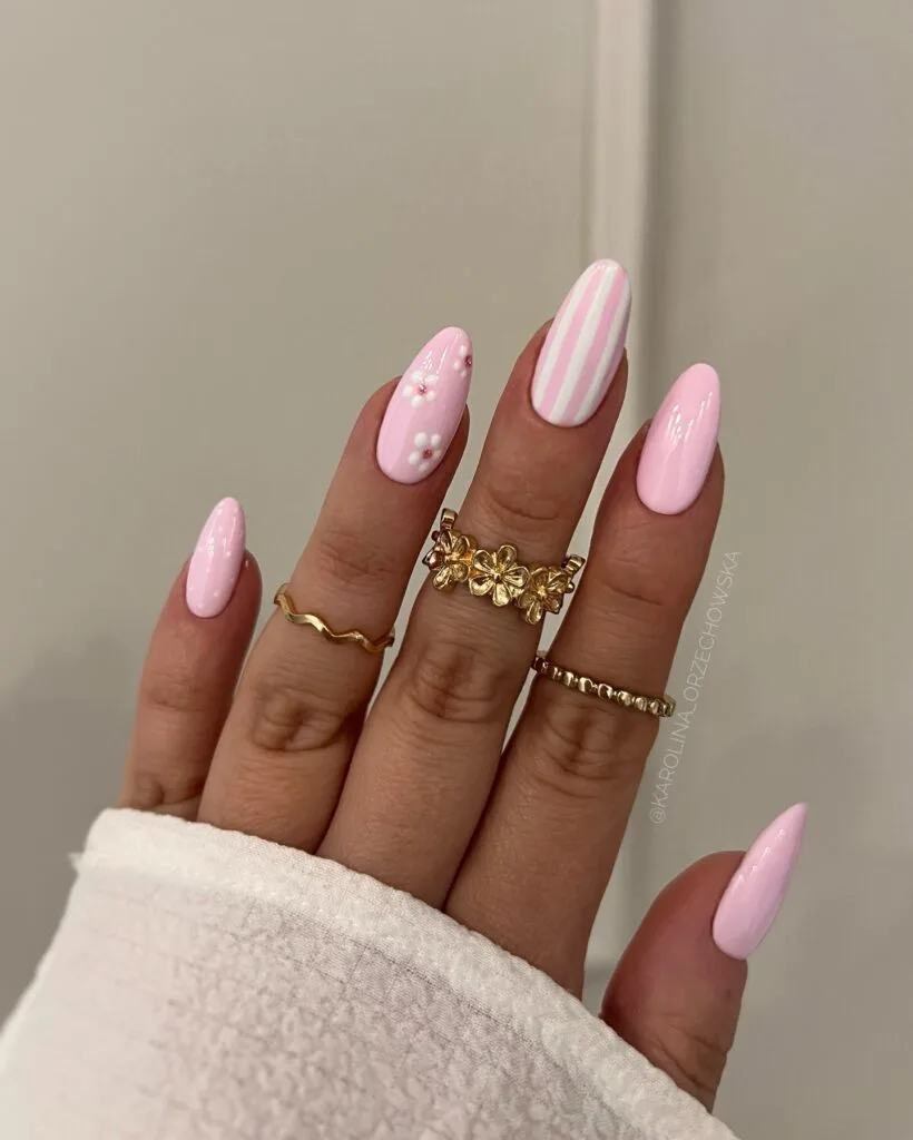 july nail colors, light pink almond nails with white 3D flower and stripe accent nails