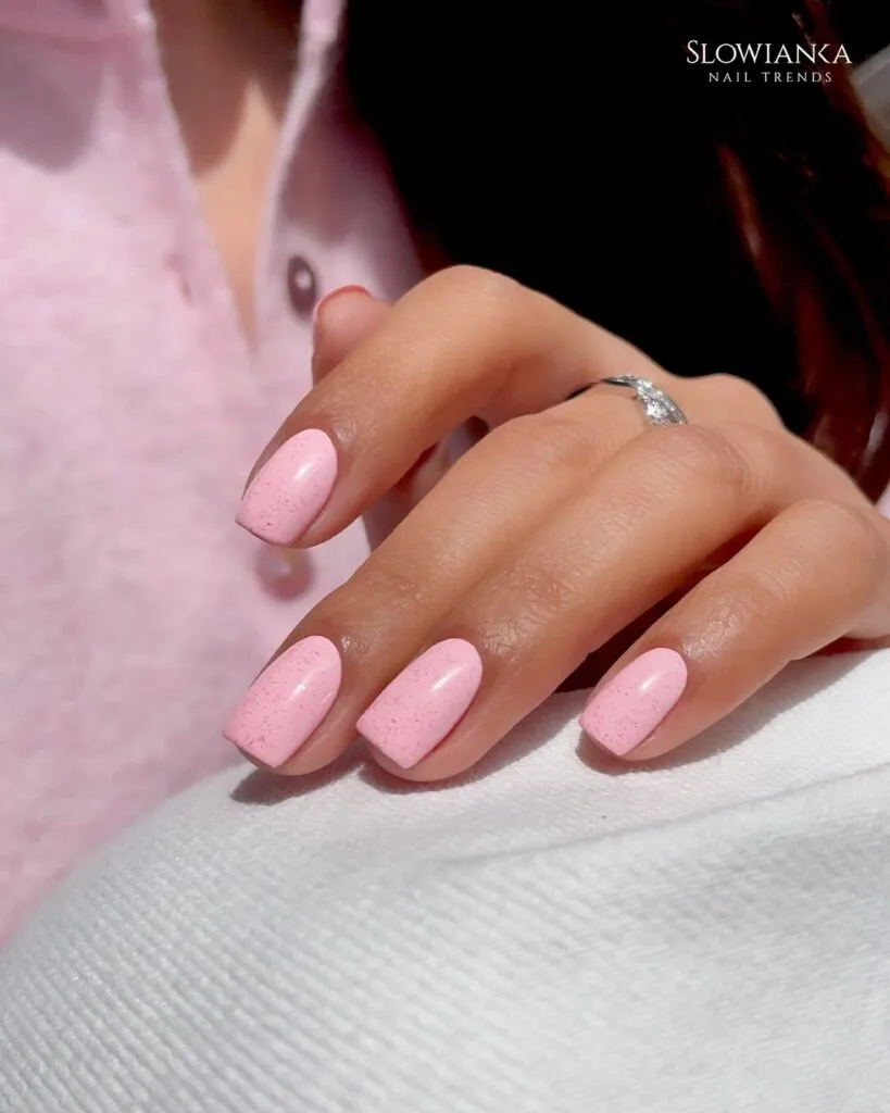 july nail colors, light pink square nails with subtle pink speckle texture
