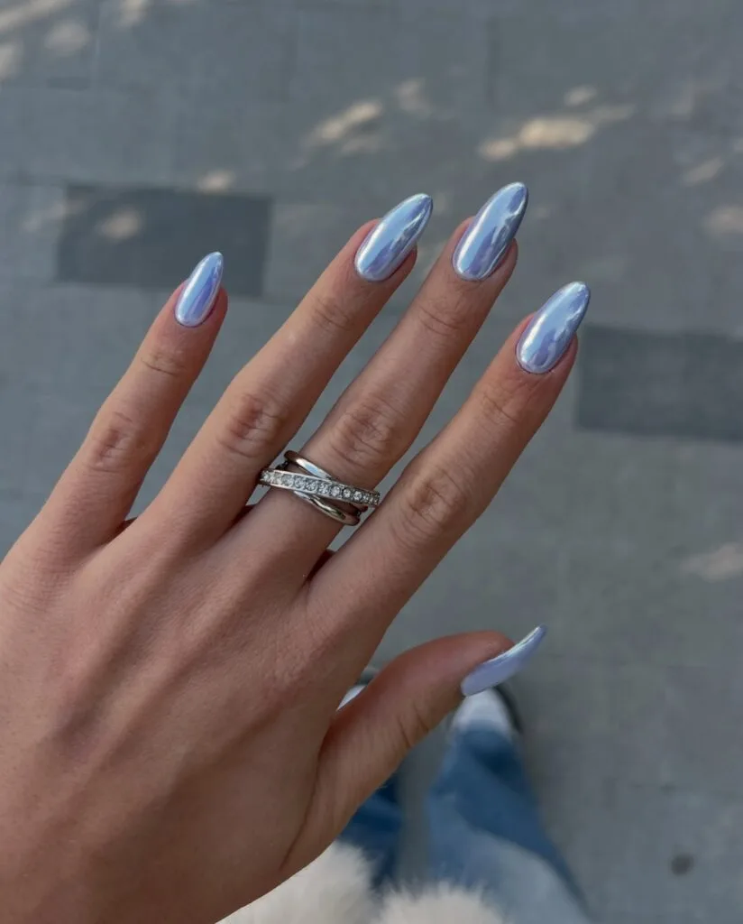 july nail colors, icy blue chrome long almond nails with mirror shine finish