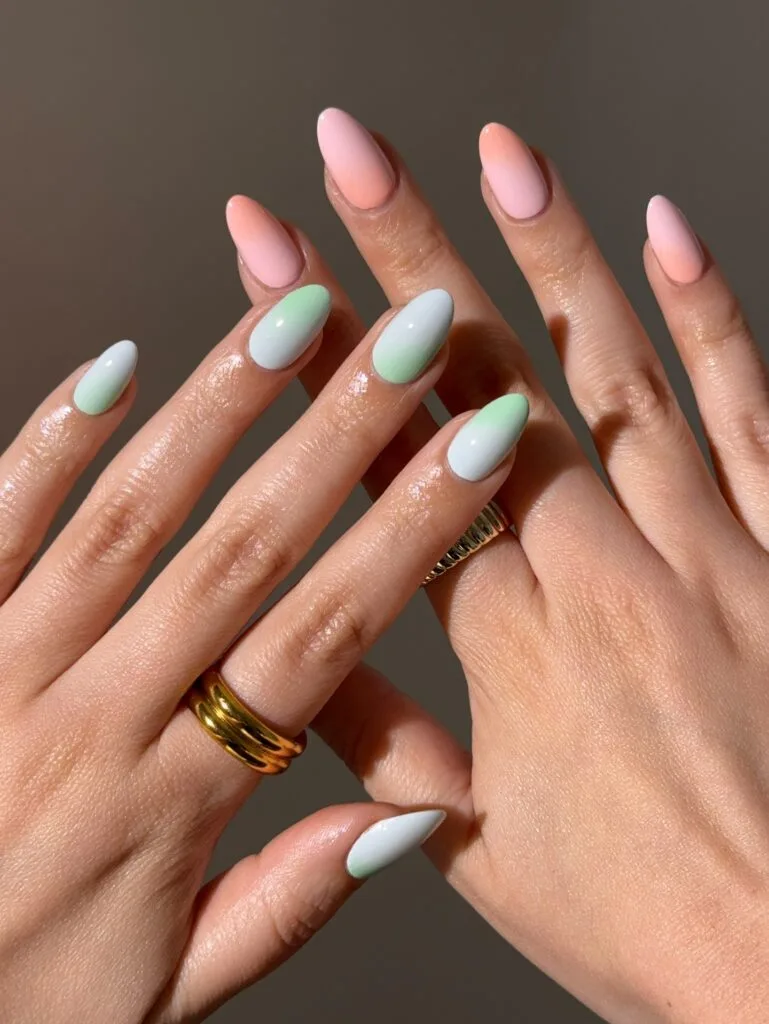 august nails, almond peach to pink and sage to blue ombre nails with soft aura gradient
