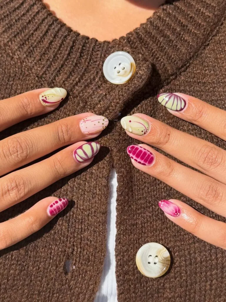 summer nails, almond abstract nail art in pistachio and plum with swirls, stripes, and dots