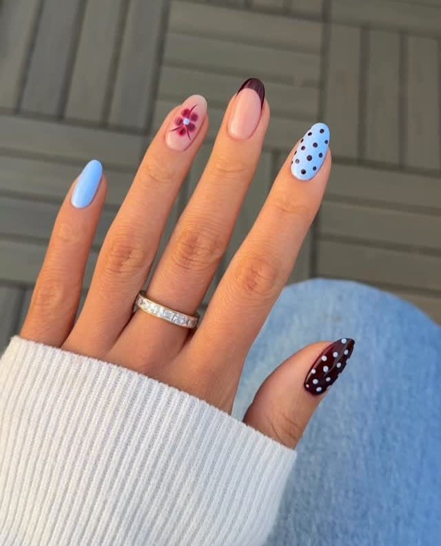 august nails, oval mix with periwinkle blue, black cherry French tip, polka dots, and burgundy flower