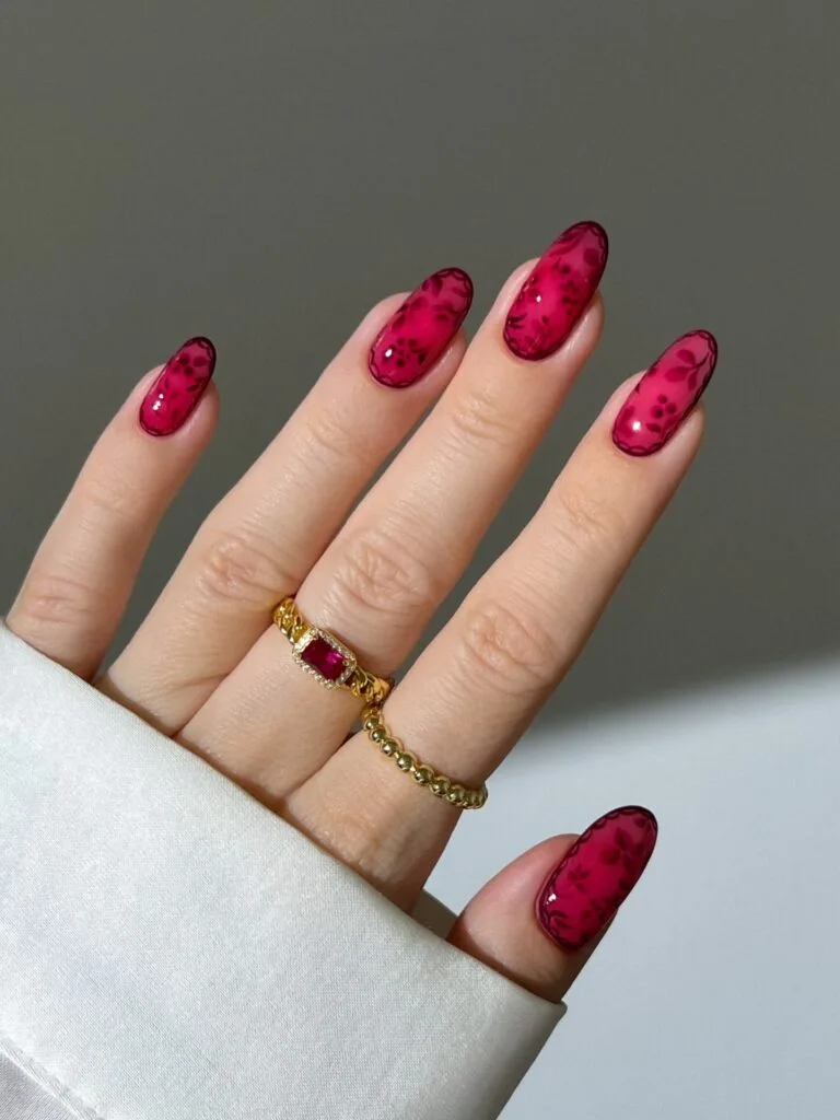 august nails, oval sheer raspberry jelly nails with wine floral art and scalloped lace border
