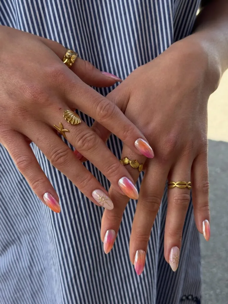 summer nail colors, almond peach pink pearl chrome nails with gold sun line art accents