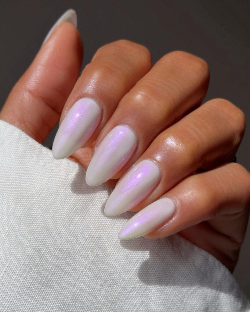 august nail colors 2026, long almond pearl white nails with pink iridescent shimmer