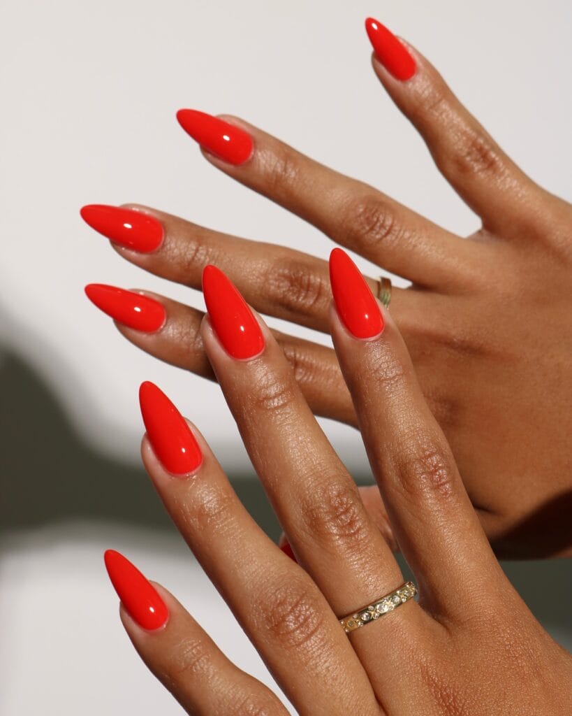 trending nail colors, long stiletto bright poppy red nails